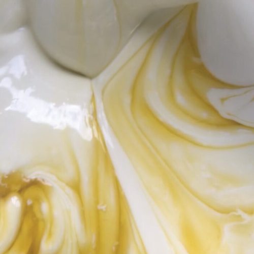 Calendula infused oil mixing with natural ingredients to make an eczema moisturiser